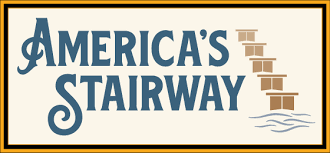 Logo for Americas Stairway with stylized blue text; the letter I in STAIRWAY is formed by a graphic of ascending brown stairs above wavy blue lines, all on a beige background with a gold and black border.