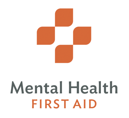 An orange cross-shaped symbol above the words Mental Health FIRST AID with Mental Health in gray and FIRST AID in orange capital letters.