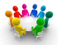 Eight colorful humanoid figures sitting around a round white table.